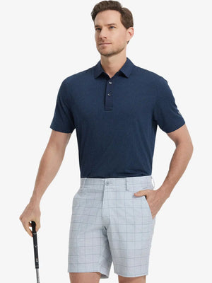 Model in NAVY Jacquard Polo posing with golf club — active and athletic on the front view