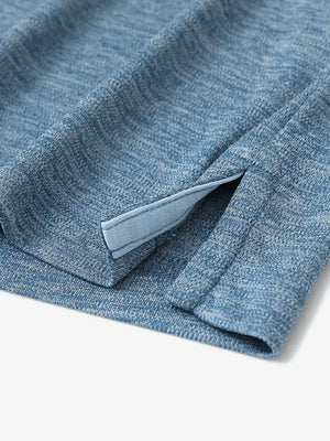 Close-up of hem opening on Modern Fit Melange Polo in GRAYISH BLUE HEATHER, highlighting quality stitching.