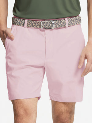 Front waist to knee view of pink water resistant golf 7 inch shorts, clean athletic fit.
