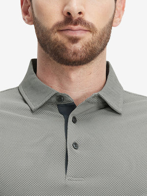 Close-up of a model wearing the black feather weight jacquard polo shirts, focusing on the collar and face