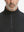 Close-up of collar area on jacquard quarter zip pullover in dark grey/black, highlighting refined jacquard detail.