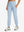 Model wearing women's stretch fleece lined water resistant joggers in light grayish blue, showcasing the front lower body view.
