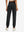 Model wearing women's stretch fleece lined water resistant joggers in black, showing the back lower body view.