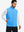 Model wearing water-resistant fleece golf vests, hand in side pocket, relaxed fit in sky blue