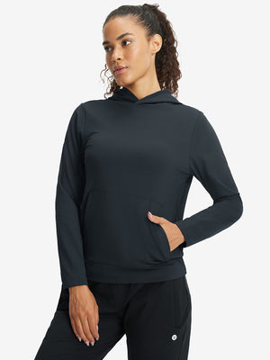 Model with one hand in side pocket wearing women's lightweight hoodies pullover in dark grey.