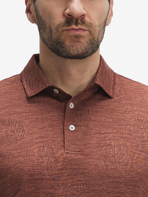 Front view from nose to chest of model wearing red flower breathable jacquard pattern 3-button golf polo