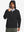 Model wearing water-resistant heat-tech softshell winter jacket with hood, black, front upper-body.