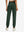 Model wearing women's stretch fleece lined water resistant joggers in forest green, showing the back lower body view.