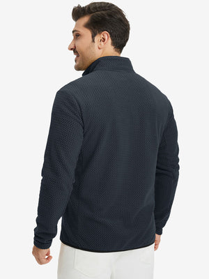 Back upper view of model in midweight warm stretchy quarter zip pullover, highlighting shoulder fit in navy.