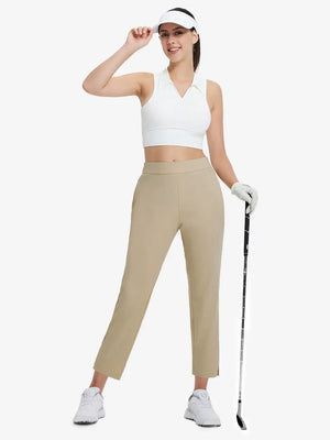 Full-body front view wearing golf hat and holding club in Khaki Women's 7/8 Ankle Golf Track Pants.