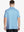 From the back, the model shows the back design of the WHITE PALM Polo shirt, clearly showing the shape and cut of the garment