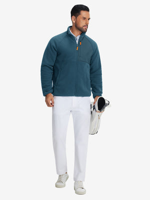 Full-body shot of the model wearing the reversible fleece jacket with 5 pockets in dark blue.