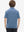 Back half-body view of youth wearing blue denim stripe performance cooling polo, showing rear design