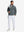Full-body shot of the model wearing the reversible fleece jacket with 5 pockets in dark grey.