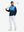 Model holding golf club wearing Fleece lined golf quarter zip in active navy/blue