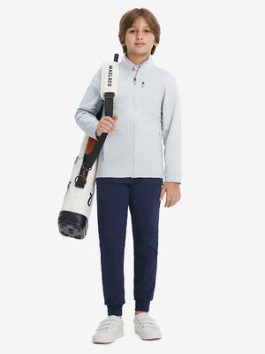 Full-body view of model wearing kids soft lightweight fleece lined jacket in misty grey, displaying the jacket's fit and design.