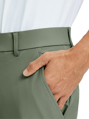 Close-up detail of one hand resting in pocket, showing relaxed fit of the olive green quick dry pants.