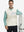 Model carrying golf bag, styled in cream print collar quarter zip golf vest, relaxed sporty fit.