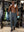 Full-body view of model in gym wearing DARK GREY Performance Tapered Sports Joggers