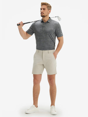 Full-body shot of model holding a golf club in grey pineapple breathable jacquard pattern 3-button golf polo
