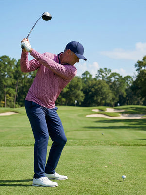 Full print lightweight quarter zip pullover, golfer swinging in red navy flower on open course scene