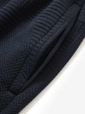 Detail of zipper pocket on soft sweatpants with 4 zipper pockets in navy