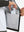 Hand placing an iPhone into pocket of water-resistant heat-tech softshell winter jacket with hood.