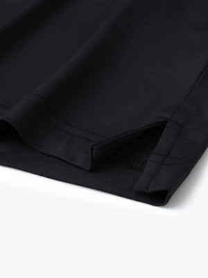 Hem slit detail of Everyday Collarless Jersey Shirt in Black.