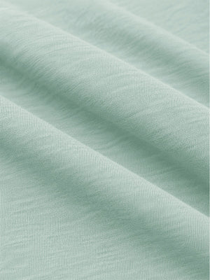 Close-up shot of soft heather knit fabric and fine textile texture, heather midlayer golf hoodies in light green heather