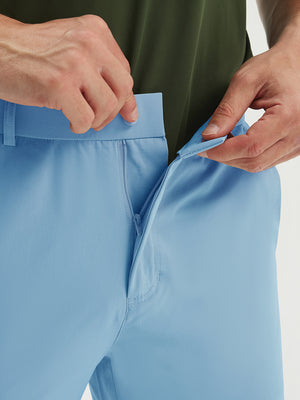 Detail view of the zipper on the light blue stretch soft flat front dress golf shorts, highlighting secure closure
