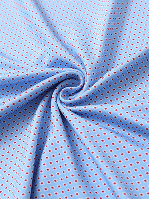 Close-up of blue red diamond performance jersey print polo fabric texture.