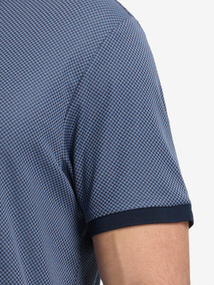 Detail shot of the sleeve cuff on the blue quick dry jacquard ribbed collar golf shirt