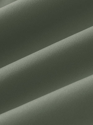 Fabric close-up of Women's 7/8 ankle golf track pants with soft texture in olive green