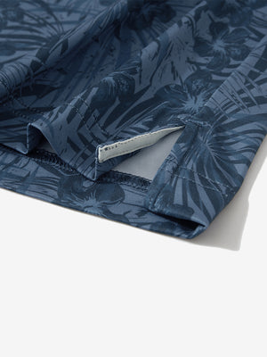 Detail: hem slit of dark blue plant stretch printed collarless henley golf shirts
