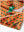 Detail: collar and hem slit of orange cactus performance print boys golf polo