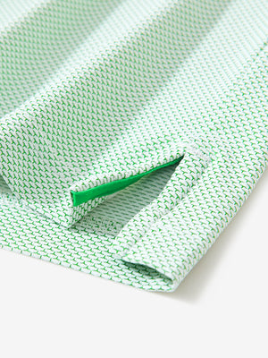 Detail of the side vent hem on the emerald feather weight jacquard polo shirts, showing the split design feature