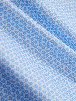 Close-up of sky blue flower performance quick dry print golf polos fabric texture