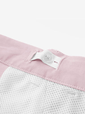 Interior shot of the waistband on the pink youth water resistant cotton blend golf pants, showing inner construction