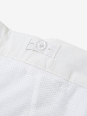 Interior shot of the waistband on the white youth water resistant cotton blend golf pants, showing inner construction