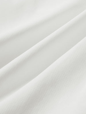 Close-up of soft mesh fabric for white superion softness mesh joggers with zipper pockets
