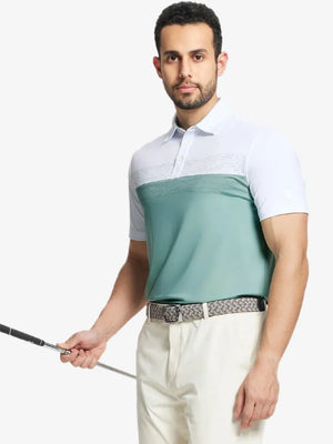 Half-body front shot holding golf club in BERYL GREEN Premium Performance Polo