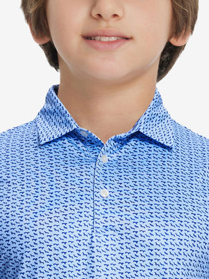 Front view of youth wearing bluejay navy dogs performance print boys golf polo, showing collar and chest fit