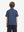 Back half-body view of youth wearing green seahorse performance print boys golf polo, showing rear design