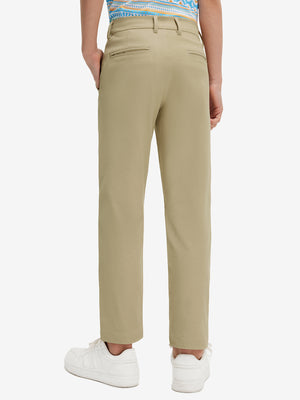 Back lower body view of model wearing the khaki youth water resistant cotton blend golf pants, highlighting the rear design