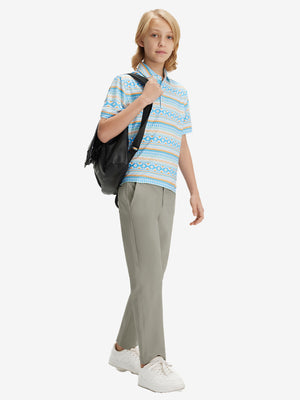Full-body front view of model wearing the khaki grey youth water resistant cotton blend golf pants for a complete look