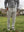 Front lower body shot of model wearing thermal water repellent fleece dress pants in light gray