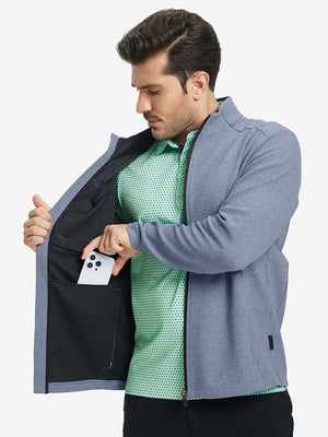 Model front half body lifting jacket, hand in inner pocket, textured insulated winter jacket, blue heather.