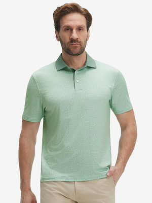 Front half-body of model in green abstract lines lightweight stretch upgraded print golf polo shirts