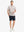 Full-body front view holding a takeaway drink cup, wearing PINE FOREST Stylish Printing Summer Shirt.